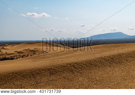 Picturesque Sarykum Dune. Sandy Mountain On The Background Of Mountains, The Caucasus. Dagestan, Rus