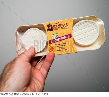Paris, France - Apr 26, 2021: Pov Male Hand Holding Package Of Delicious Rocamadour Cheese From The 