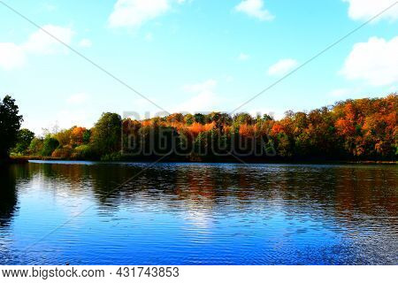 Caldera Lake Holzmaar Near Gillenfeld In Autumn Colors With Reflection In The Lake