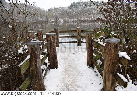 Wooden Platform In The Holzmaar With Snow