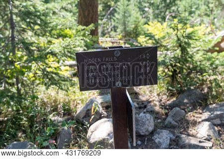 Sign For Various Hiking Trails In Grand Teton National Park, For Hidden Falls, Lake Solitude, String