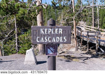 Keplar Cascades Waterfall In Yellowstone National Park - Sign