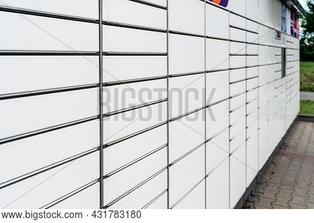 Automated Locker. Parcel Courier Box In Woman Hands At Post Delivery Automat Terminal. Courier Puts 