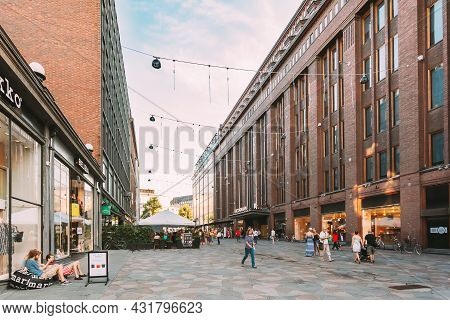 Helsinki, Finland - July 28, 2014: View Of Kluuvikatu Street. People Walk Down Street On A Summer Ev