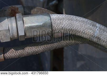Close-up Of An Old Automotive Line With Connecting Bottle - Hydraulic Hose
