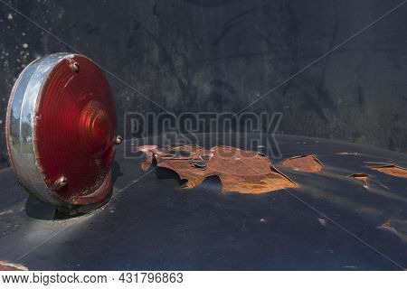 Close-up Of A Rotten Boundary Light With Chipped Paint