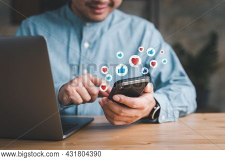 Social Media And Digital Online Concept, Man Using Smart Phone With Social Media. The Concept Of Liv