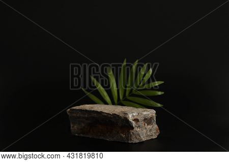 Rock Podium On The Black Background With Tropical Leaves. Stone Podest For Product, Cosmetic Present