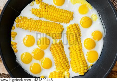 Top Above View Of Many Tasty Healthy Small Chicken Quial Eggs With Boiled Corn Slice Fried On Pan. B