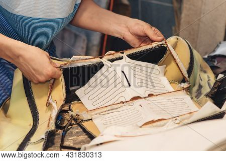 Repair Of The Old Car Seat. Car Mechanic's Hands Is Using Tools. Working Hands Of A Man At The Car S