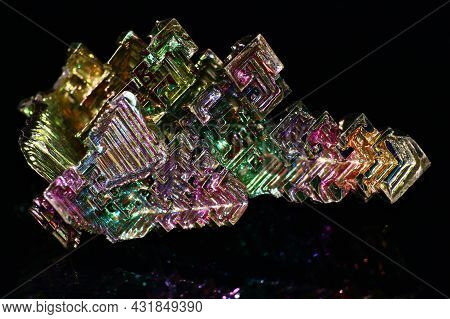 Synthetic Bismuth Bismuthum Crystal With Iridescent Oxide Film On Black Background Close Up