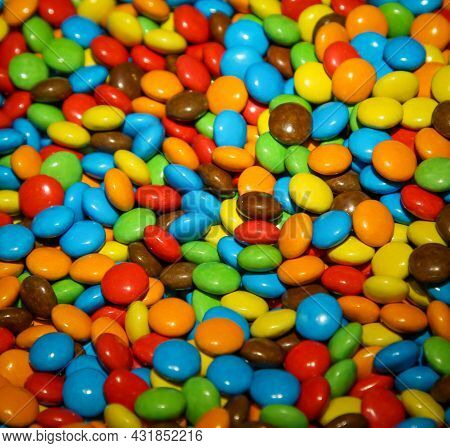 Sweet Temptation Made From Lots Of Colorful Chocolate Buttons.