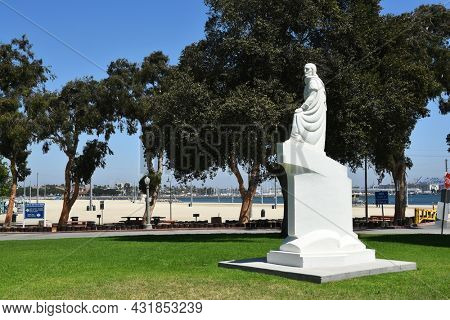 SAN PEDRO, CALIFORNIA - 27 AUG 2021: Juan Rodriguez Cabrillo Statue with Cabrillo Beach in the background.