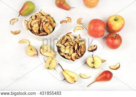 Homemade Apple Chips In A Cup With Apples On A White Background, In Autumn Apples Are Baked In The O