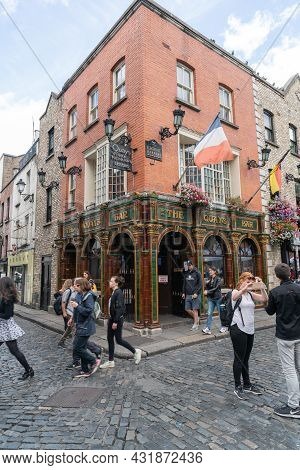 Dublin, Ireland - August 10 2017; Young Tourists In Street Outside Well Known Irish The Quays Bar In