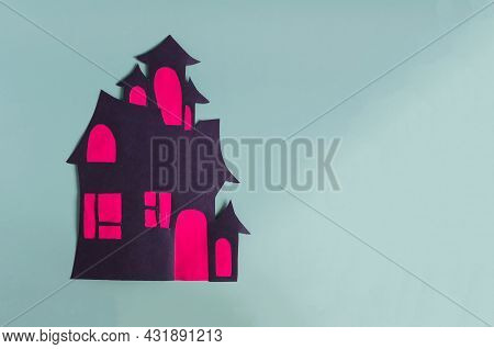 An Application Made Of Cardboard Is A Dark House With Red Windows On A Light Background. Children's 