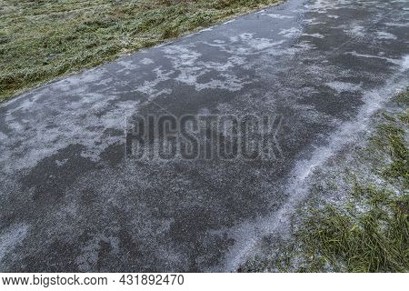 Slippery Road Covered Ice. Frozen Winter Way After Freezing Rain