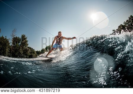 Beautiful View Of Splashing Wave And Man Riding It On Foilboard
