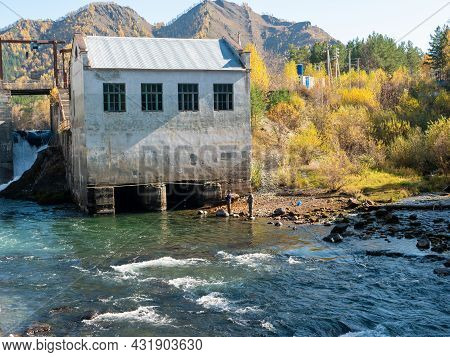 Chemal Hydroelectric Power Station. Fishermen Fish In The Katun River. Chemal, Altai Republic, Russi