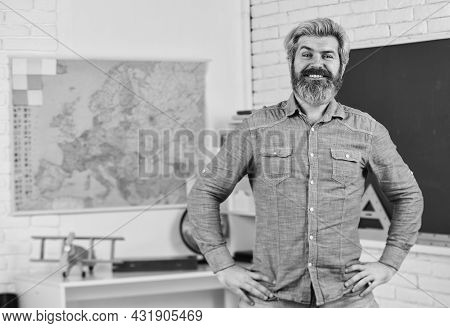 School Subject. History And Geography. Science Concept. Mature Bearded Teacher In Classroom. Private