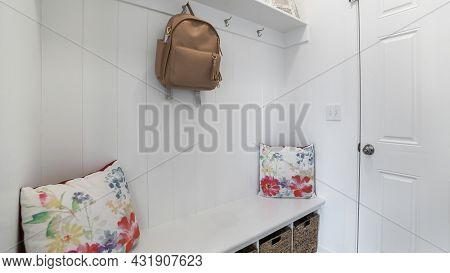 Pano Interior Of A White Mud Room With White Door, Built-in White Bench And Wall Mounted Hooks And S