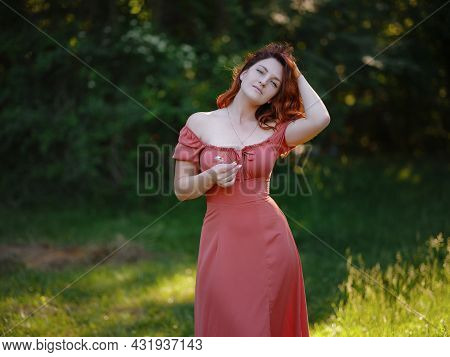 Beautiful Woman Enjoying The Silence Of The Summer Forest
