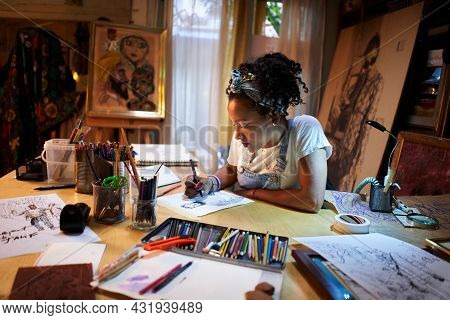 A Fashion Designer Draws A Sketch With An Idea For The Clothes Of The Future. Creating A Portrait: T