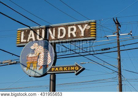 Yakima, Washington - July 6, 2021: Retro Vintage Laundry Sign And Parking For A Laundromat