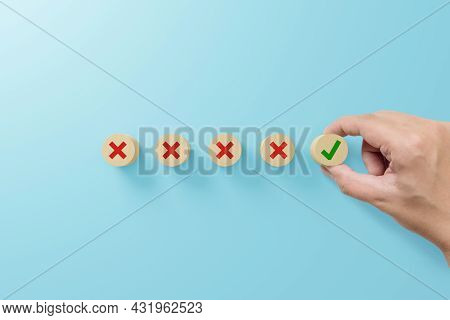 Checklist And Check Mark Concept. Check Mark And X Sign Symbol On Wooden Blocks On Light Blue Backgr