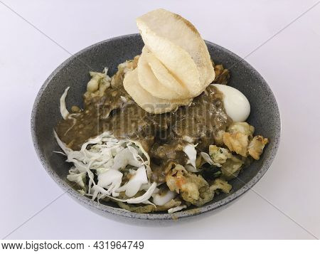 Gado-gado. Traditional Indonesian Food. Rice Cake, Egg And Vegetable With Peanut Sauce.