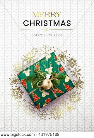 Merry Christmas Greetings. Poster With A Gift Box And A Wreath Of Snowflakes