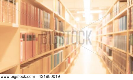 Abstract Blurred Public Library Interior Space. Blurry Room With Bookshelves By Defocused Effect. Us