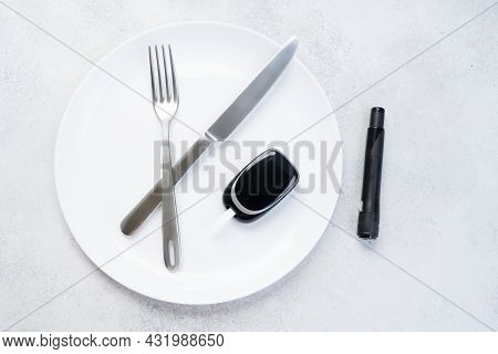 Diabetes Diet Planning Concept, Empty Plate With Fork, Knife And Glukemetr, Fasting Diet And Dieabet