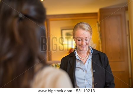 Beautiful blond hotel receptionist