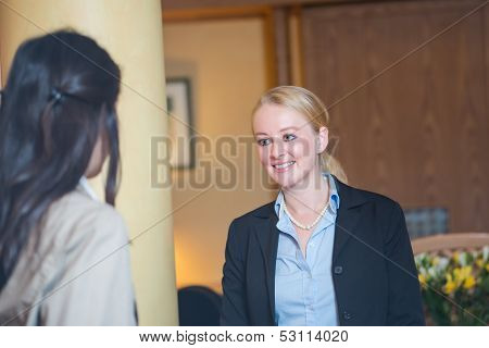 Beautiful blond hotel receptionist