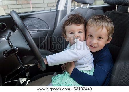Children Sit In The Car