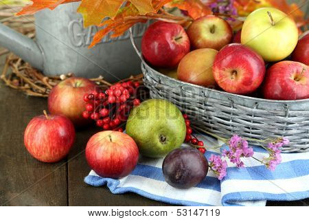 Juicy apples in basket on table close-up