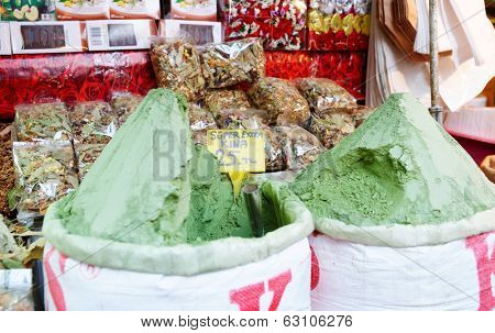 Sacks with henna paint on oriental market