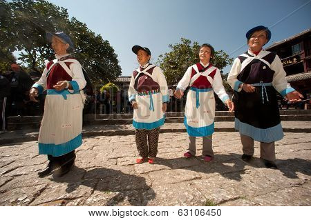 Chinese Naxi Old Woman Performing A Dance.