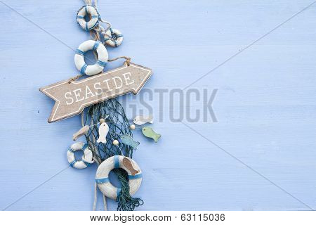 Blue Background With A Signpost To The Seaside