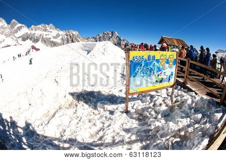Groups Of Traveler On Wooden Stair Of Jade Dragon Snow Mountain,lijiang,yunnan,southwestern China.