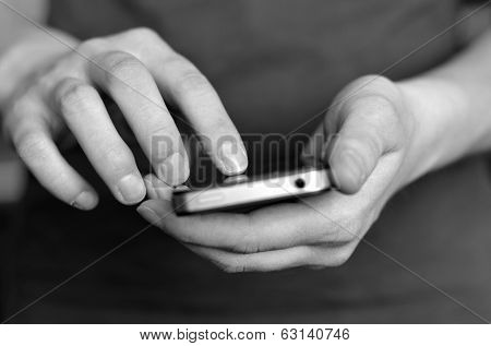 Person holding smart phone in hands to communicate and text