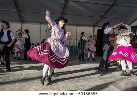 MERTOLA, PORTUGAL - MARCH 29: An unidentified children performs a Traditional Portuguese folkloric music on stage at river fish festival  MARCH 29, 2014 in Mertola, Portugal.