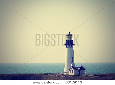  a lighthouse in the fog done with a retro vintage instagram filter 