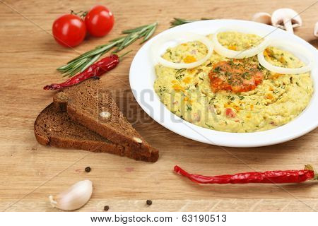 Bowl of tasty fresh hummus, close up