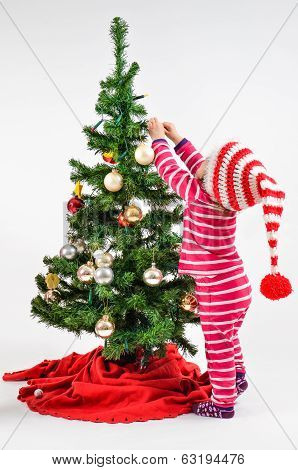 A Baby And A Christmas Tree