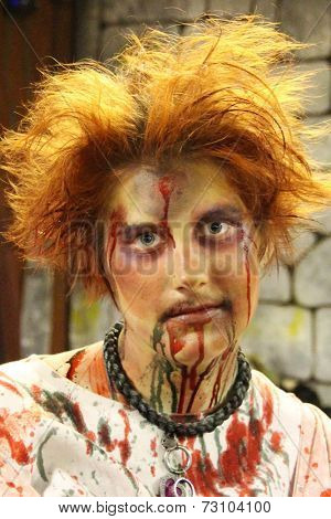 MUSKOGEE, OK - Sept. 13: Bloody zombies wait for runners to attack during the Castle Zombie Run at the Castle of Muskogee in Muskogee, OK on September 13, 2014. 