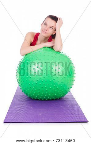 Young woman exercising with swiss ball