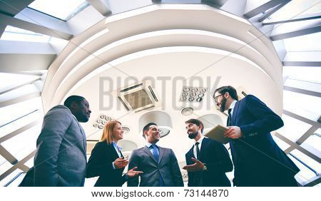 Group of competitive business people discussing ideas or plans
