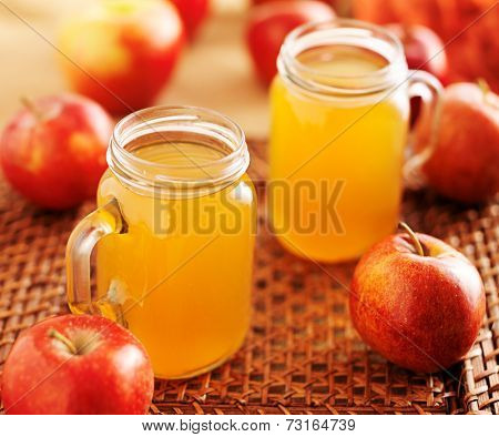 mason jars filled with hot apple cider